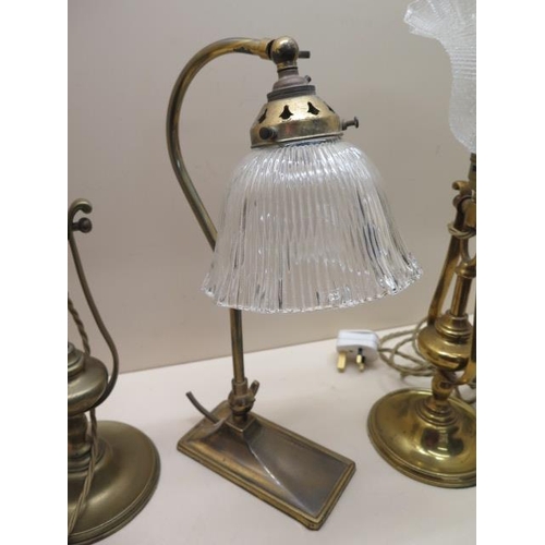 646 - Two similar tilting weighted pullman type brass lamps, one with shade and a brass desk lamp - Height... 