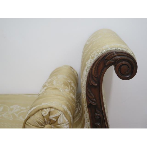 653 - A Regency carved mahogany scroll end recently reupholstered window seat on turned shaped octagonal l... 