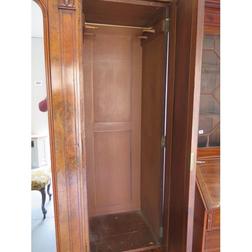 654 - A good quality mid Victorian burr walnut breakfront wardrobe with a central mirrored door flanked by... 