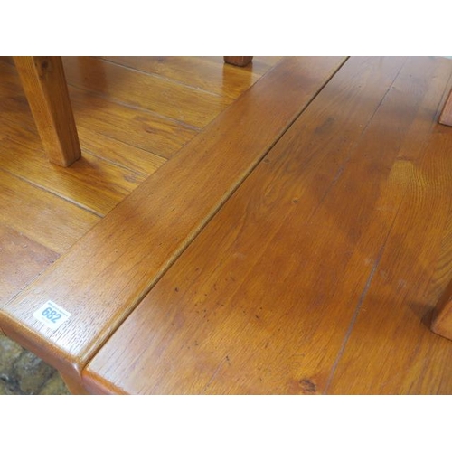 682 - An oak French made dining table with two additional leaves and eight rush seated chairs including tw... 