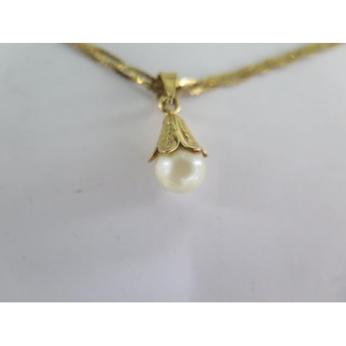 8 - An 18ct yellow gold pearl pendant on a 42cm 18ct chain - approx weight 6 grams - generally good