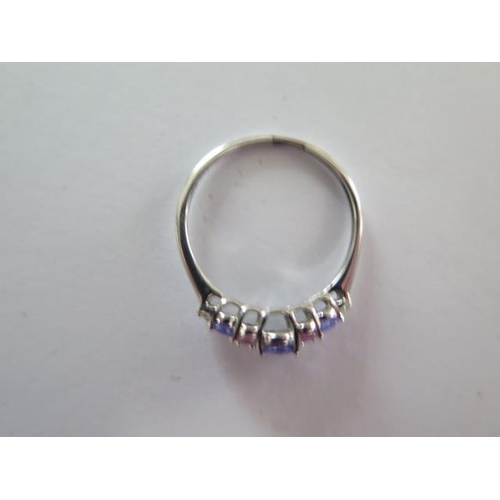 83 - A 9ct white gold Tanzanite, pink sapphire and diamond ring size R - approx weight 1.6 grams - with c... 