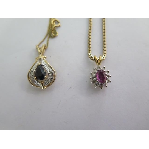9 - A 9ct pendant on a fine gold chain and a gilt metal pendant on a 9ct chain - total weight approx 7.6... 