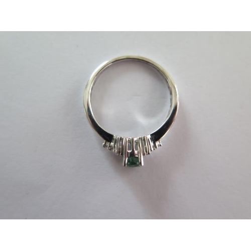 91 - An 18ct white gold emerald and diamond ring size O/P - approx weight 3 grams - with certificate, goo... 