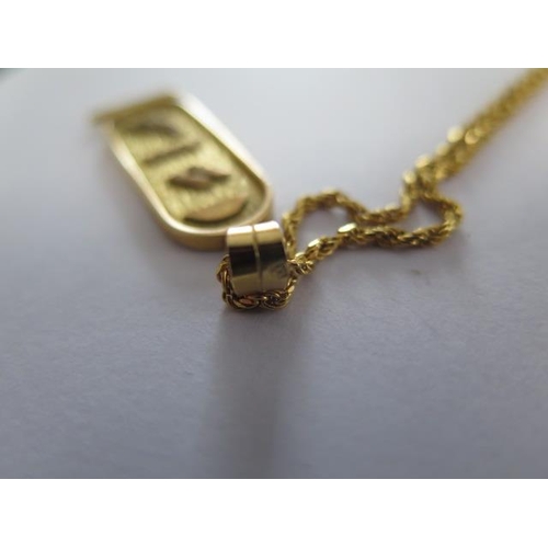 95 - An Egyptian 18ct gold pendant on a 9ct 50cm chain - total weight approx 11.2 grams - pendant 4.2 gra... 