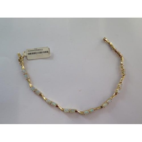 99 - A 14ct yellow gold opal bracelet - approx weight 6 grams - RRP £795 - approx weight 6 grams - in goo... 