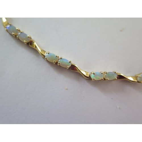 99 - A 14ct yellow gold opal bracelet - approx weight 6 grams - RRP £795 - approx weight 6 grams - in goo... 