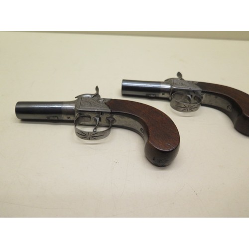 503 - A pair of percussion cap pistols by Horsley - Length 15cm - with screw off barrels, both cock and fi... 