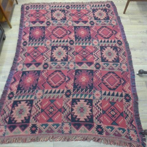 203 - A Kilim rug with a red field, 175cm x 127cm