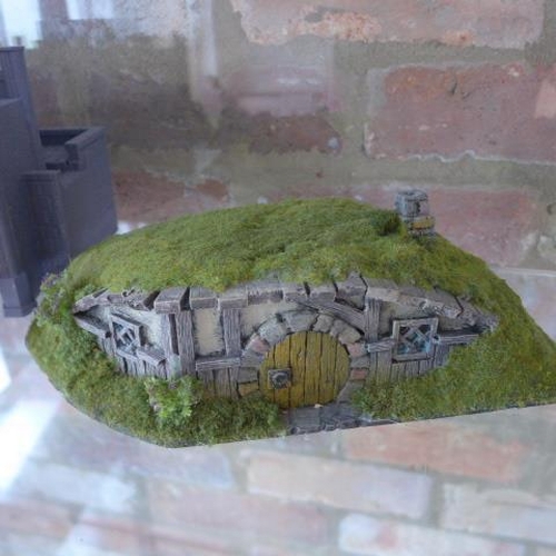 212 - A collection of War Gaming buildings terrain and trees