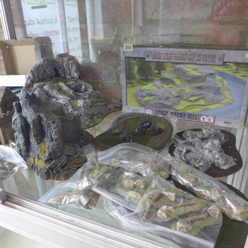 214 - A collection of War Gaming scenery, 14 river bends, six ponds, a boxed rocky hill, assorted rocky ou... 