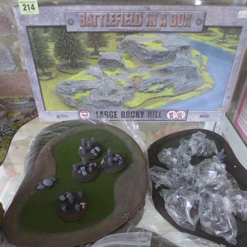 214 - A collection of War Gaming scenery, 14 river bends, six ponds, a boxed rocky hill, assorted rocky ou... 