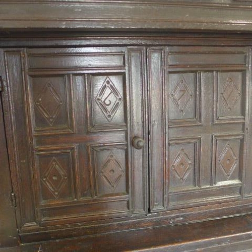 89 - An 18th century carved oak court cupboard with four doors - Height 178cm x Width 103cm