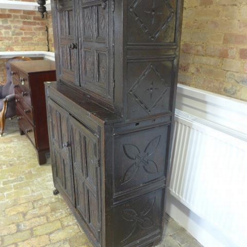 89 - An 18th century carved oak court cupboard with four doors - Height 178cm x Width 103cm