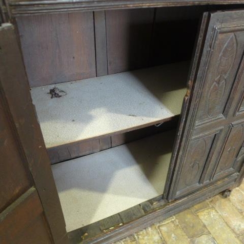 89 - An 18th century carved oak court cupboard with four doors - Height 178cm x Width 103cm