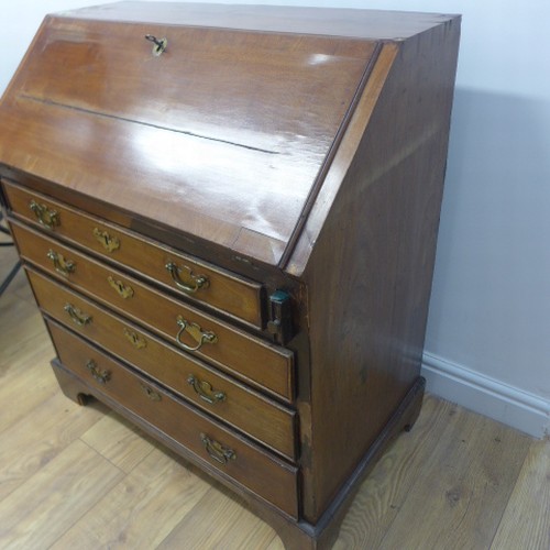 90 - A Georgian mahogany bureau with a well fitted interior over four drawers - Width 84cm x Height 96cm