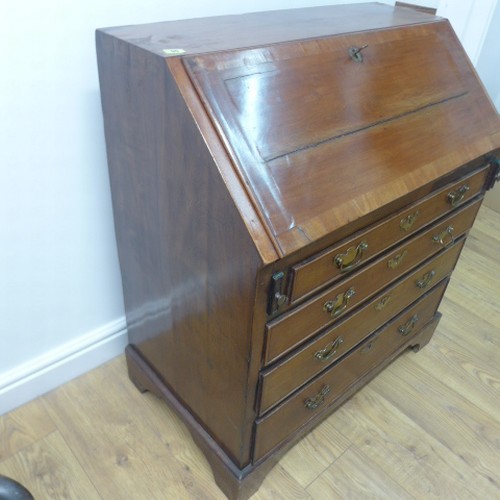 90 - A Georgian mahogany bureau with a well fitted interior over four drawers - Width 84cm x Height 96cm