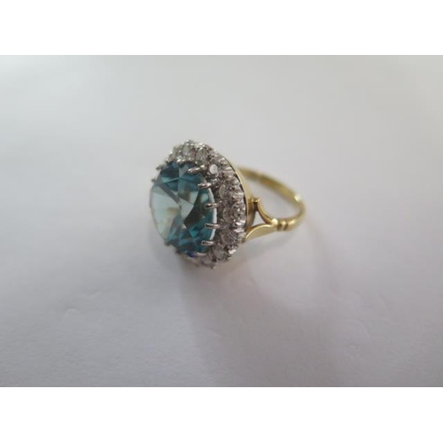 1 - A 9ct yellow gold diamond and blue stone ring (possibly Zircon or Topaz) the centre stone approx 13.... 