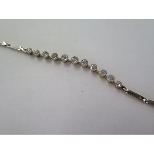 102 - A diamond set bracelet, yellow gold and white metal fronted, with expanding links to a centre sectio... 