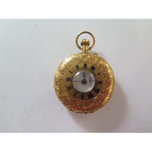 256 - An 18ct yellow gold half Hunter pocket watch with 35mm case, gold dust cover, approx 32 grams, good ... 