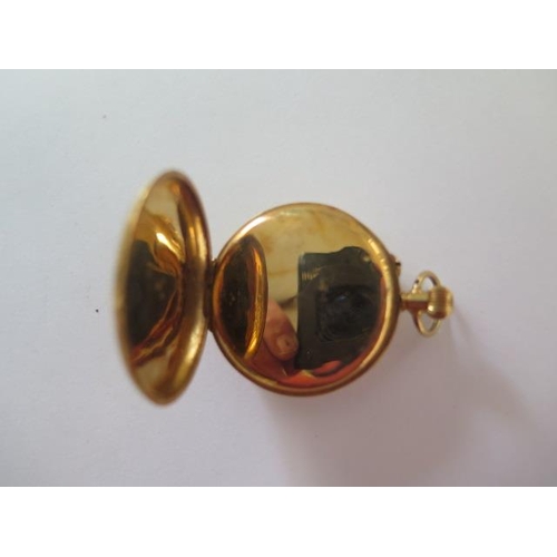 256 - An 18ct yellow gold half Hunter pocket watch with 35mm case, gold dust cover, approx 32 grams, good ... 