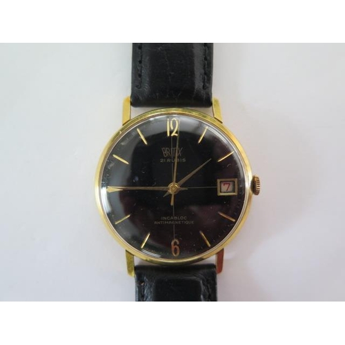 259 - An 18ct yellow gold manual wind gents Britix wristwatch with date, black dial, 33mm case, total weig... 