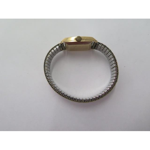 261 - A 9ct yellow gold ladies Omega wristwatch on a plated strap, not currently running, glass cracked, w... 