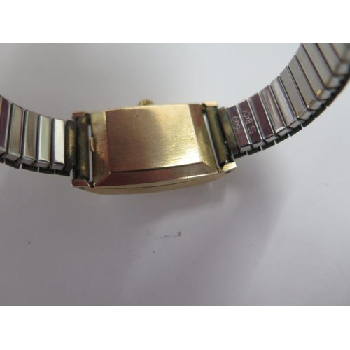 261 - A 9ct yellow gold ladies Omega wristwatch on a plated strap, not currently running, glass cracked, w... 