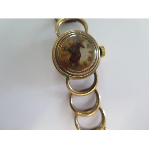 266 - A 9ct gold ladies wristwatch, not currently running, water damaged, weight approx 15.6 grams