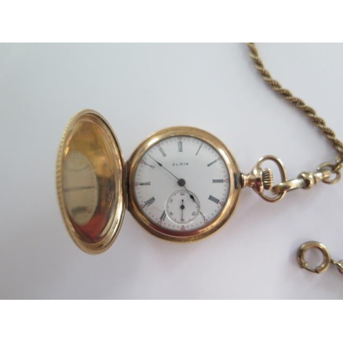 267 - An Elgin gold plated Hunter pocket watch on a 41cm gold plated double Albert chain, 35mm wide case, ... 