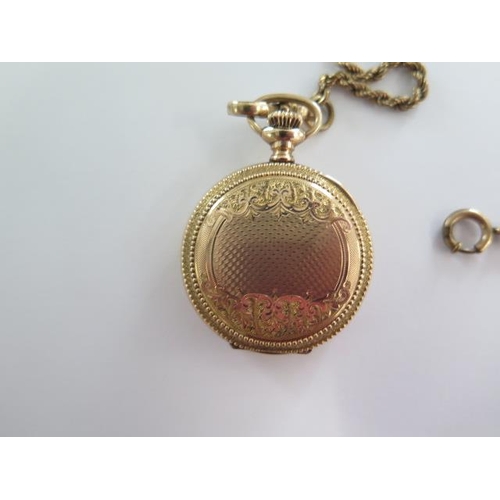 267 - An Elgin gold plated Hunter pocket watch on a 41cm gold plated double Albert chain, 35mm wide case, ... 