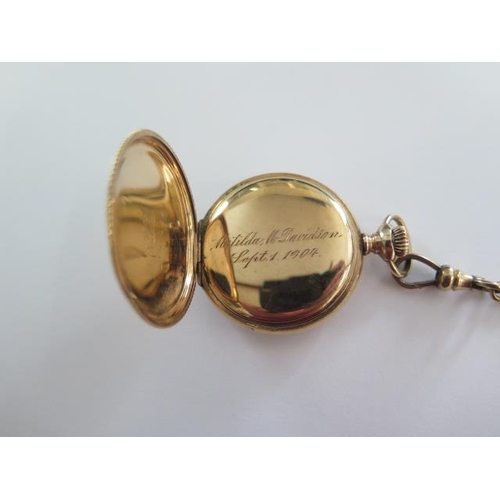 267 - An Elgin gold plated Hunter pocket watch on a 41cm gold plated double Albert chain, 35mm wide case, ... 