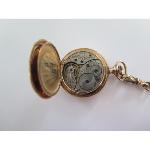 267 - An Elgin gold plated Hunter pocket watch on a 41cm gold plated double Albert chain, 35mm wide case, ... 