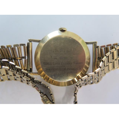 284 - A gents 9ct yellow gold manual wind Excalibur presentation wristwatch on a 9ct strap - 33mm case - t... 