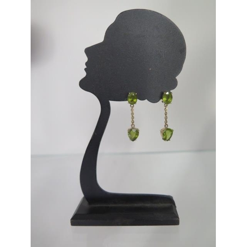 69 - A pair of 14ct yellow gold Peridot drop earrings 2.5cm long, approx 4 grams with receipts, condition... 