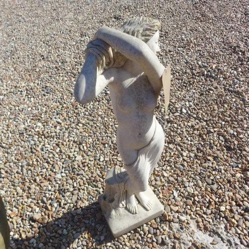 713 - A stone effect garden statue, 82cm tall