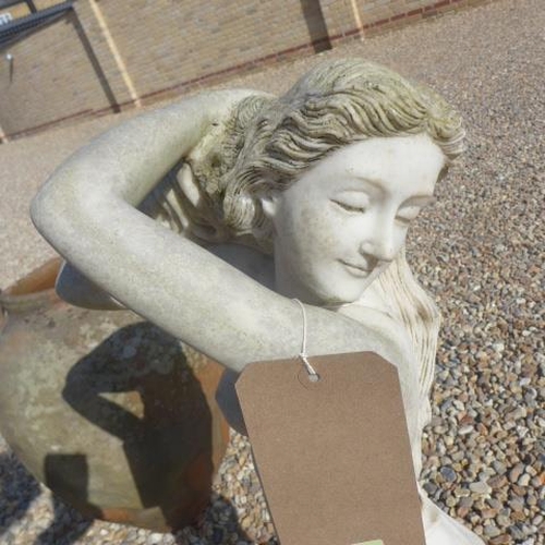 713 - A stone effect garden statue, 82cm tall