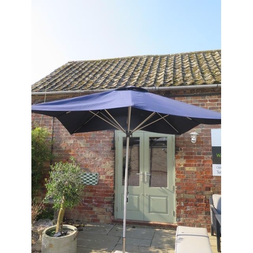 714 - An ex-demonstration blue 2.4m cord pull parasol (base not included)