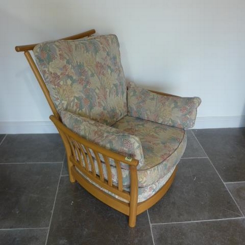 720 - An Ercol Golden Dawn upholstered elm slatted armchair in good condition - Height 96cm x Width 84cm