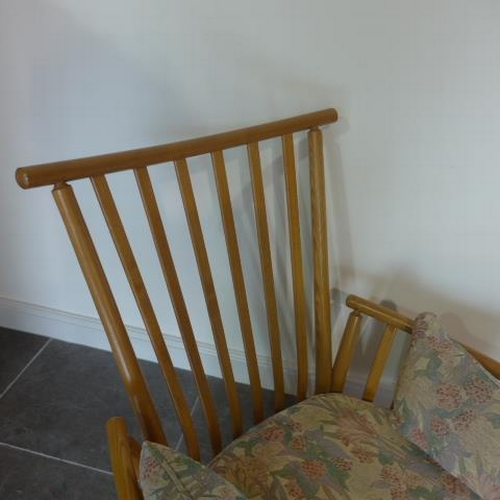 720 - An Ercol Golden Dawn upholstered elm slatted armchair in good condition - Height 96cm x Width 84cm