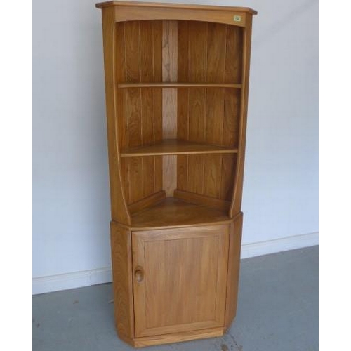 722 - An Ercol elm corner cabinet with a single door - Height 160cm - as new