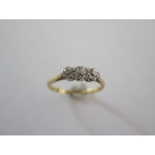 76 - An 18ct yellow gold and platinum three stone diamond ring, size K, approx 2 grams, diamonds bright a... 