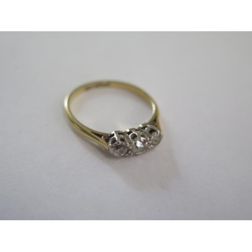 76 - An 18ct yellow gold and platinum three stone diamond ring, size K, approx 2 grams, diamonds bright a... 