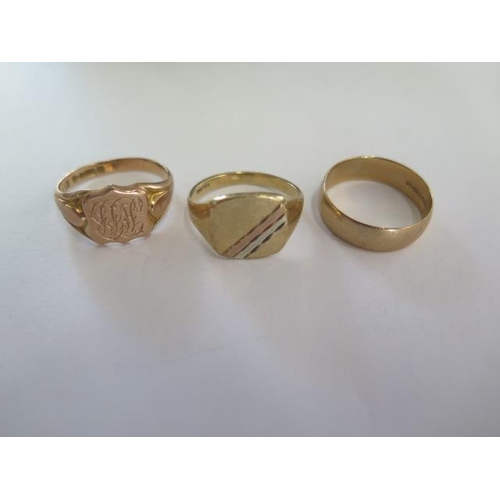 90 - Two 9ct yellow gold signet rings and a band ring, sizes Q and S, total approx 10.8 grams