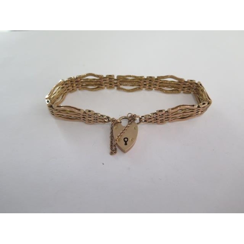 98 - A 9ct yellow gold gate link bracelet - approx weight 20.6 grams