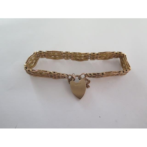 98 - A 9ct yellow gold gate link bracelet - approx weight 20.6 grams