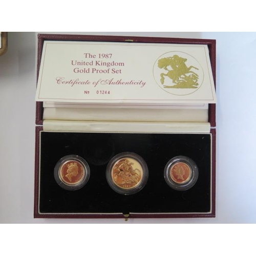 A 1987 gold proof United Kingdom sovereign, half sovereign and two pound set - boxed with certificate