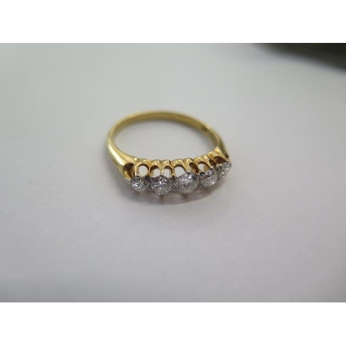 67 - An 18ct yellow gold five stone diamond ring size U - centre stone approx 0.25ct - stones bright and ... 