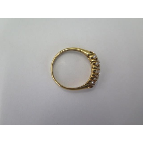 67 - An 18ct yellow gold five stone diamond ring size U - centre stone approx 0.25ct - stones bright and ... 