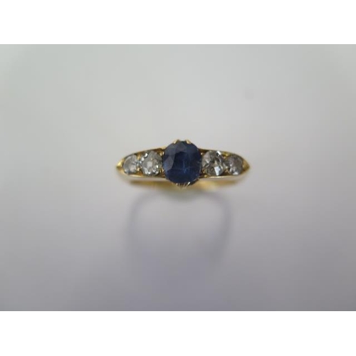 68 - An 18ct yellow gold sapphire type stone and diamond ring size Q - approx weight 4.2 grams - diamonds... 